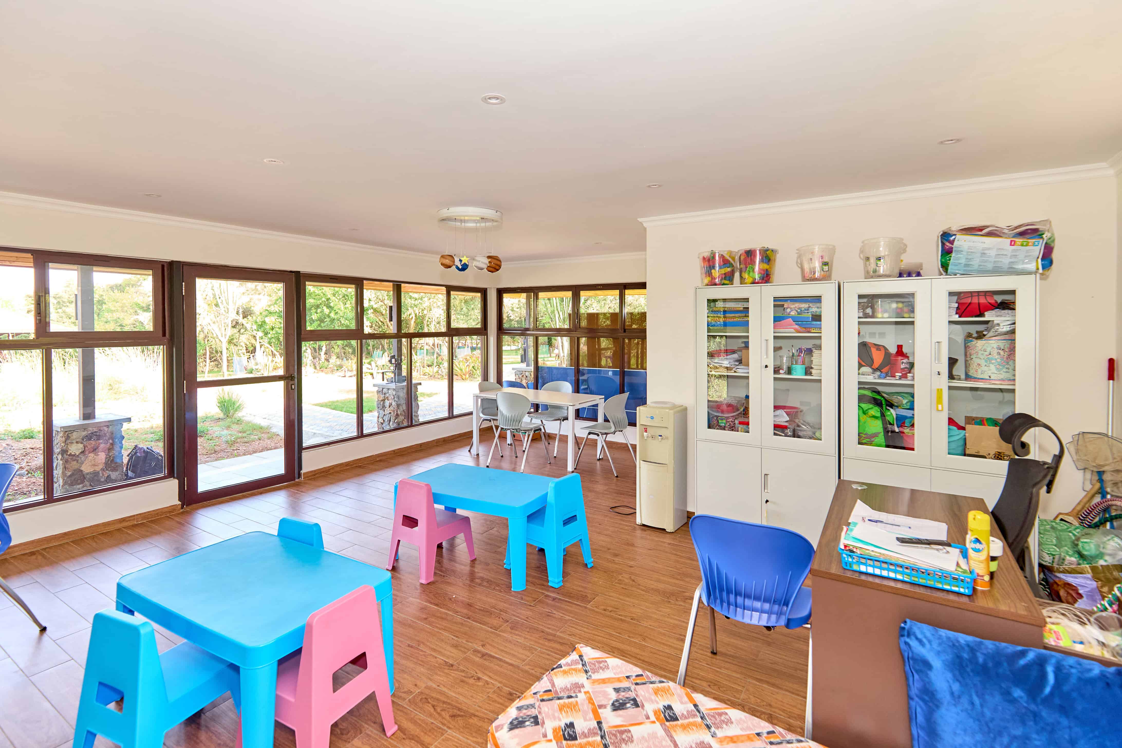 Colorful children's activity room with toys, games, and play furniture