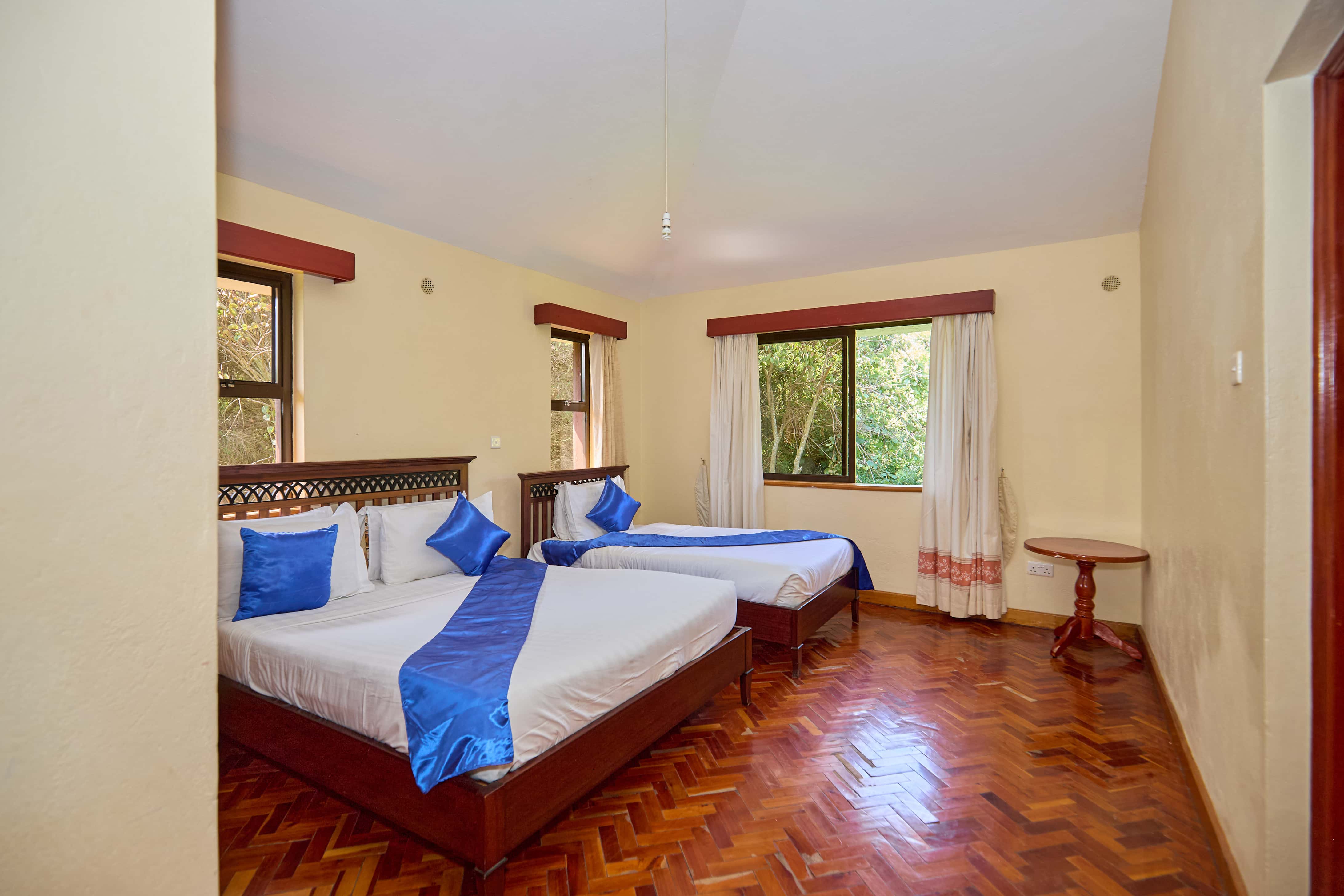 Spacious bedroom with parquet flooring