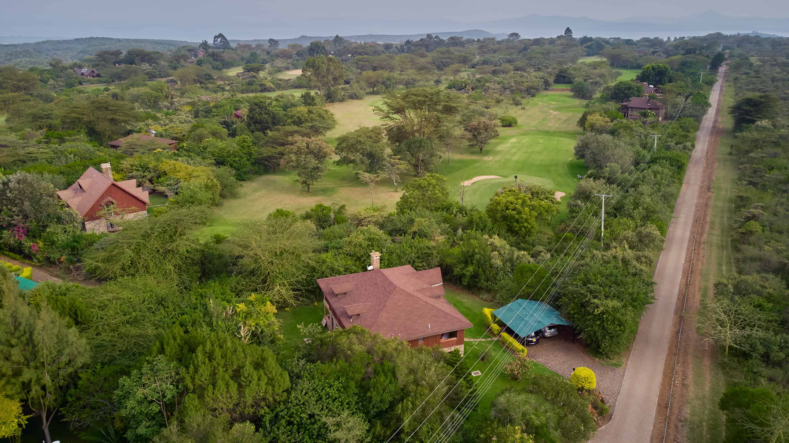 Aerial view showing chalet overlooking the 16th hole of golf course