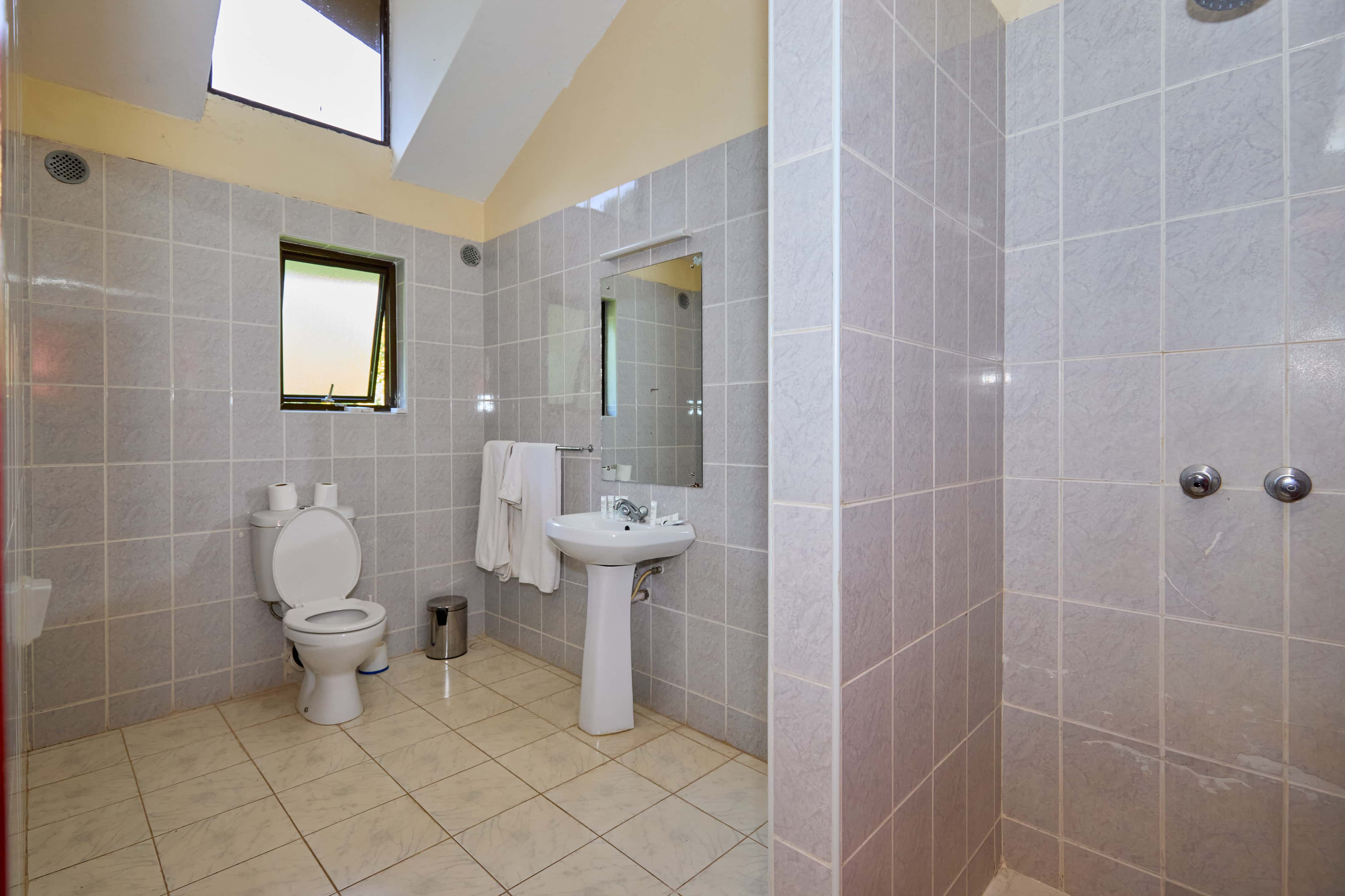 Modern bathroom with tiled walls and shower
